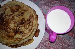 Photo of Pancakes served with milk Pancakes served with milk