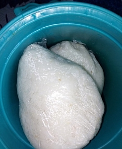 Tuwo shinkafa wrapped with transparent nylon bags and stored in a coolor to keep warm