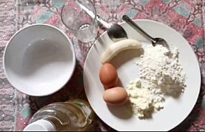 Plate containing 2 eggs, powdered milk, maize (corn) flour and banana as recipes for Infant formula