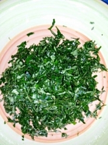 Uziza leaves being shredded into thin slices