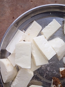 Photo of Yam being sliced into rectangular shapes Yam being sliced into rectangular shapes
