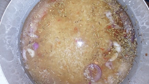 Photo of Add water slightly above the rice, such that the rice will get soft before the water dries up Add water slightly above the rice, such that the rice will get soft before the water dries up