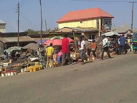 Women selling Yams, Irish Potatoes and other food stuff along Odus road at Angwan Rukuba