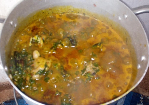 Edikaikong soup simmering on a low heat