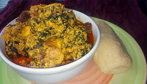 Serve egusi soup with pounded yam or fufu and enjoy your meal
