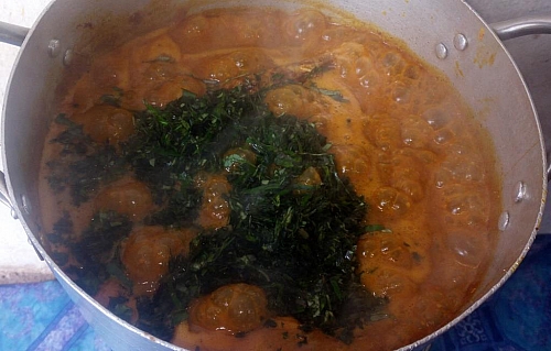 The leaf is being added to ogbono soup (I used bitter leaf and uziza)