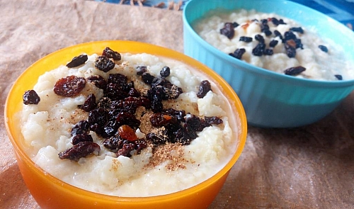 Creamy rice pudding topped with cinnamon and raisins
