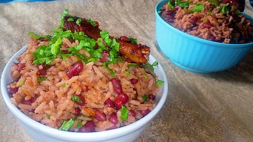  Red beans and rice meal is served with celery and fried chicken
