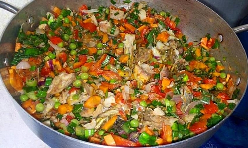 Cooking of vegetables in vegetable oil for Sweet potato and White kidney beans porridge. You can add all the vegetables to the porridge directly without having to fry it first, it