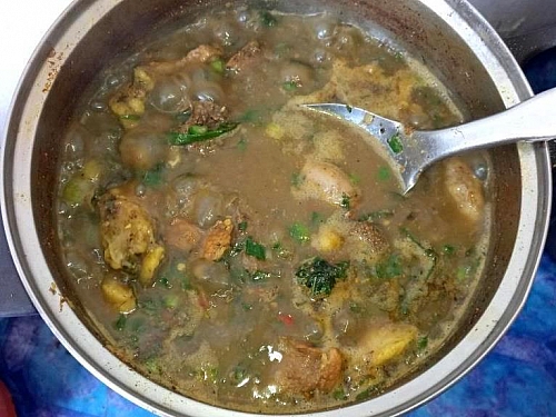 Photo of Scent leaf and spring onions are being added to assorted pepper soup Scent leaf and spring onions are being added to assorted pepper soup