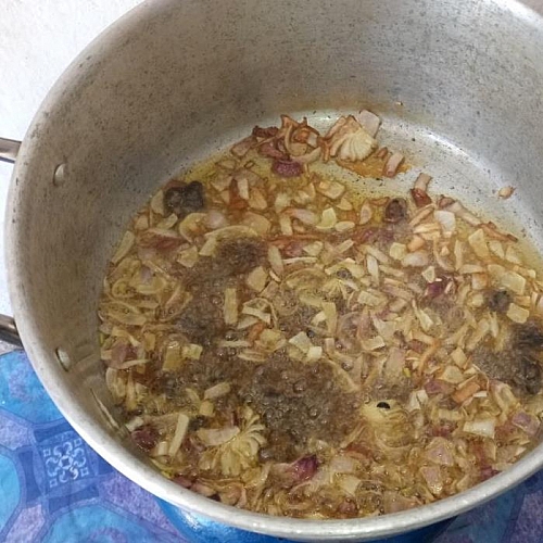 Frying of Onions and Iru (locust beans in bleached oil