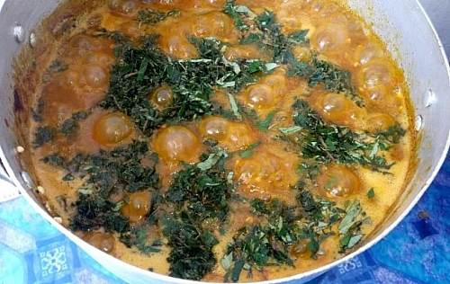 Uziza leaf is being added to ogbono soup, spinach, pumpkin or other leafy veggies could be used