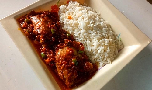 Serving of Chicken stew with boiled rice