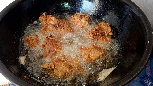 Deep fry the chicken for about 15- 20 minutes until it is all crisp and golden
