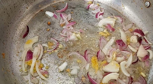 Frying onions, garlic and ginger for shrimp fried rice