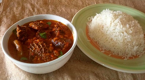 Carrot stew served with boiled rice