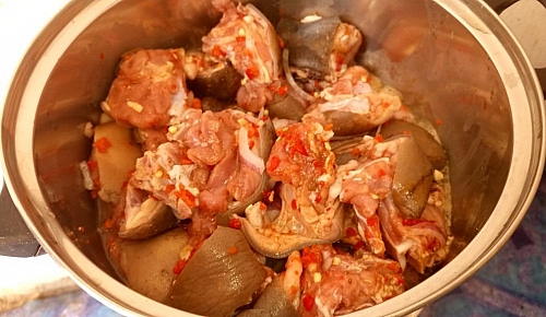 Marinating of smoked goat meat for Asun recipe