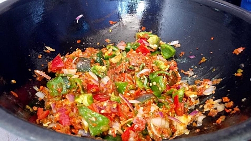 After you have seasoned the pepper with spices, you can now add the chopped bell peppers to the sauce and fry for few minutes
