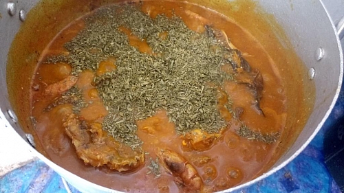 Once the soup has cooked for a while and the cocoyam has dissolved, add the shredded Ukazi and the Uziz/Ugu depending on which one you are using