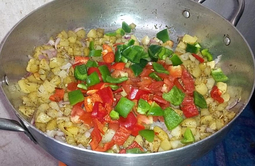 Add the bell peppers stir all to combine, these will add some crunch to the stir fry potatoes