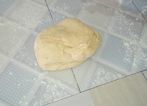 The dough should be soft and not sticky at, if it is sticky add a little dry flour to it and mix to adjust it texture