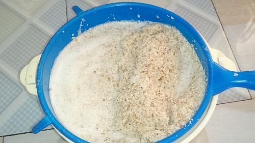 A cheese cloth works better, but you can use a fine strainer as well