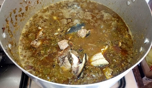 The smoked fish is added towards the end of the cooking , this is to prevent it form scattering into the stew during the stirring process