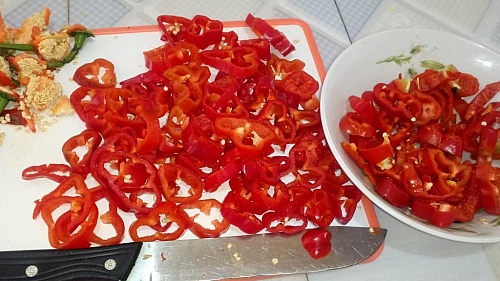 Cut peppers into thin slices to dry it faster